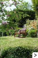 Above the patio, the small lawned area has additional seating where visitors can relax and enjoy the wonderful views.